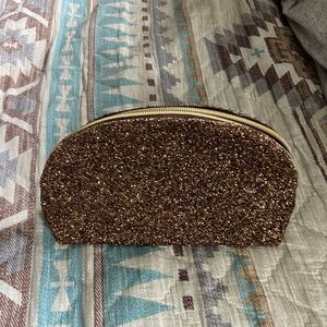 A small glittery makeup bag